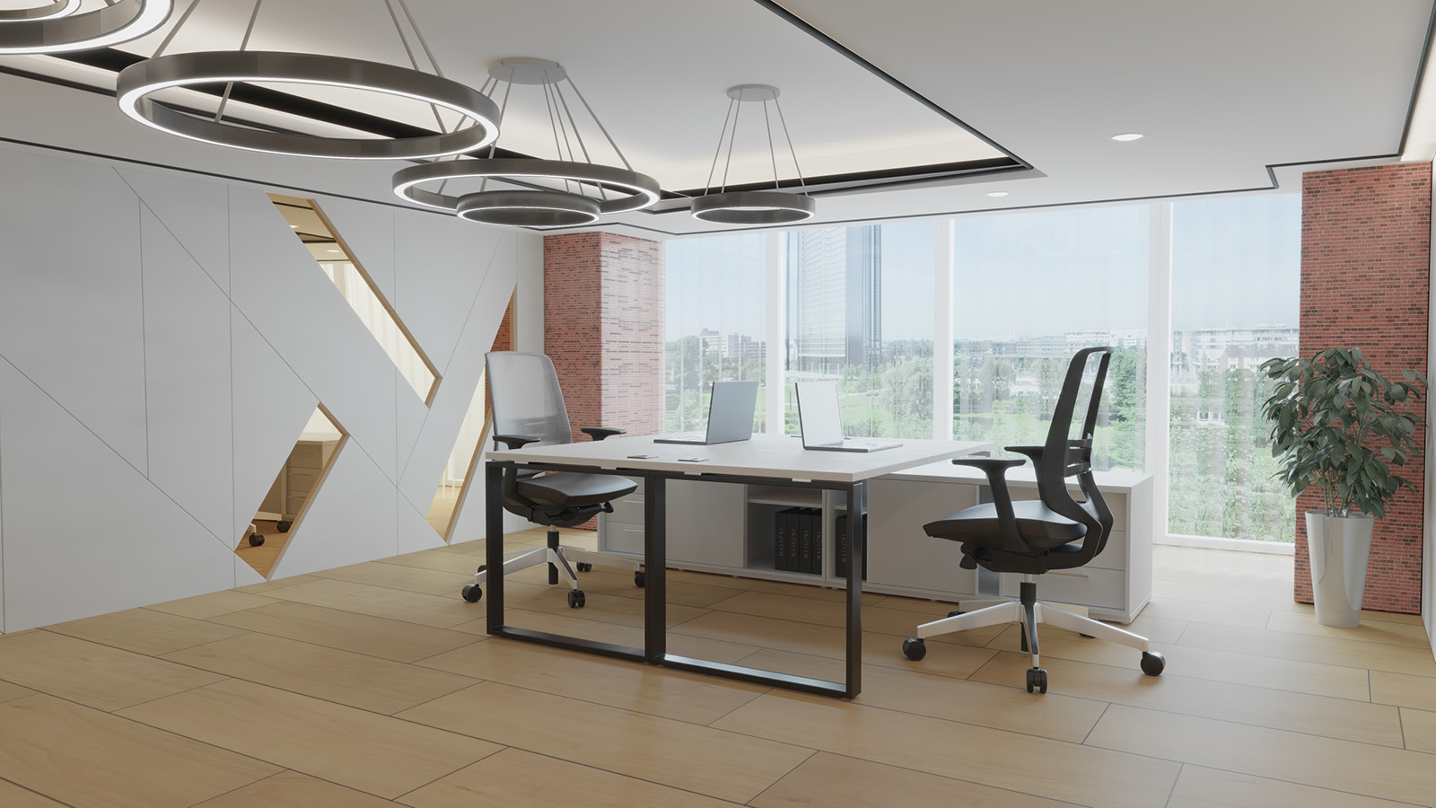 Nowoczesne biuro zostało wyposażone w zestaw do pracy zespołowej - duże biało-czarne biurka z komodami i obrotowymi fotelami.